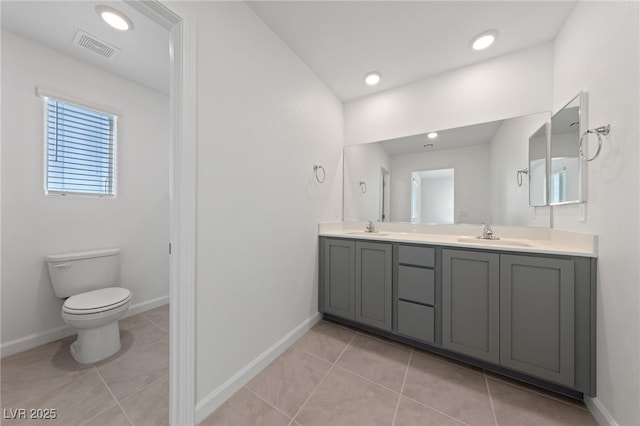 bathroom with visible vents, tile patterned flooring, a sink, and toilet