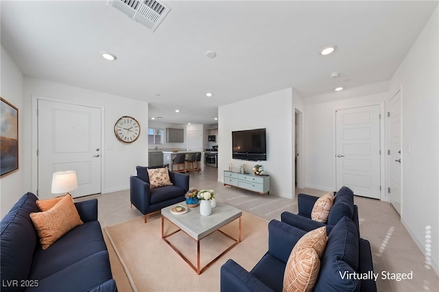 living area with recessed lighting, visible vents, baseboards, and light tile patterned floors