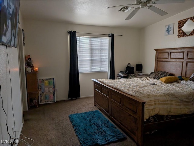 bedroom with carpet floors, visible vents, and ceiling fan