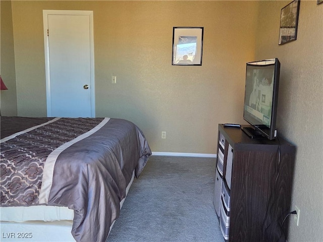 bedroom featuring carpet flooring and baseboards