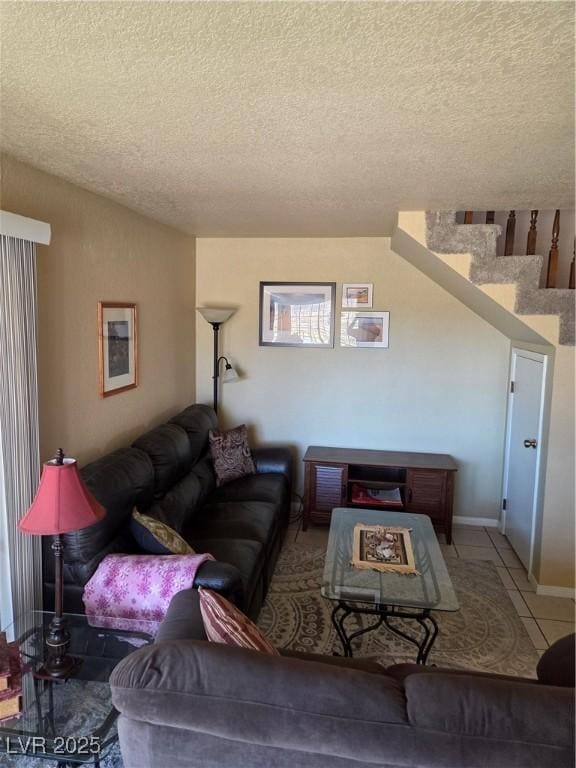 living room featuring a textured ceiling, stairway, vaulted ceiling, and tile patterned floors