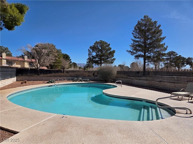 view of pool featuring a fenced in pool, a fenced backyard, and a patio