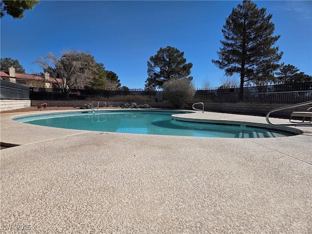 view of pool featuring a patio area, fence, and a fenced in pool