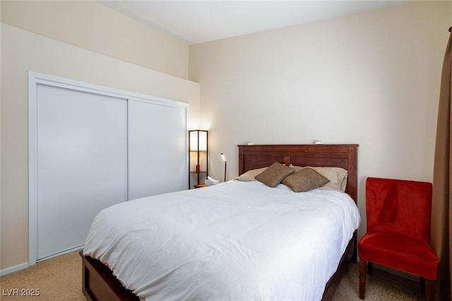 bedroom with carpet floors and a closet