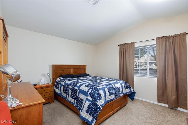 bedroom with lofted ceiling, light carpet, visible vents, and baseboards