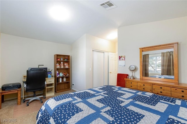 bedroom featuring carpet floors, a closet, and visible vents