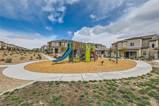 community jungle gym with a residential view