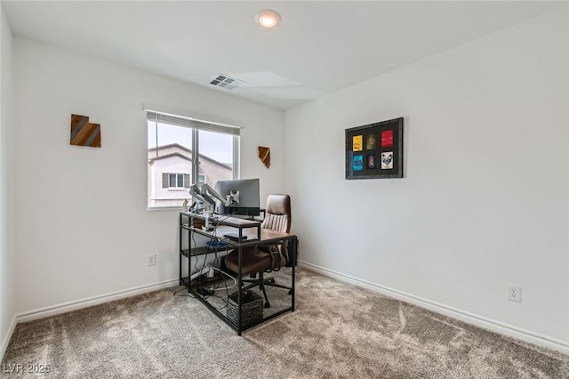 carpeted home office featuring baseboards and visible vents