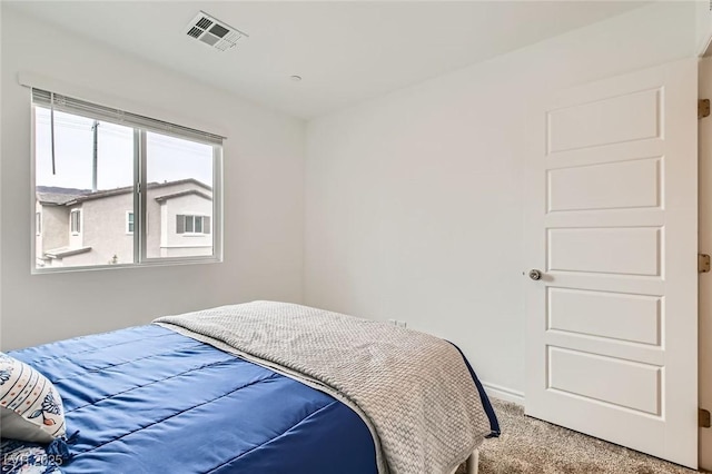 bedroom with carpet floors and visible vents