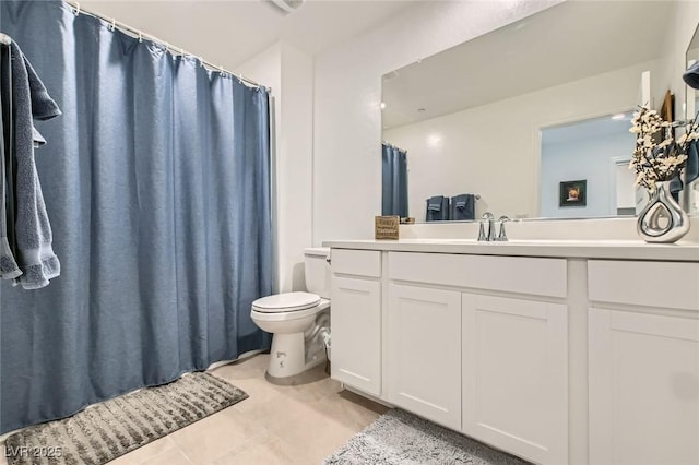 full bath with vanity, toilet, and tile patterned floors