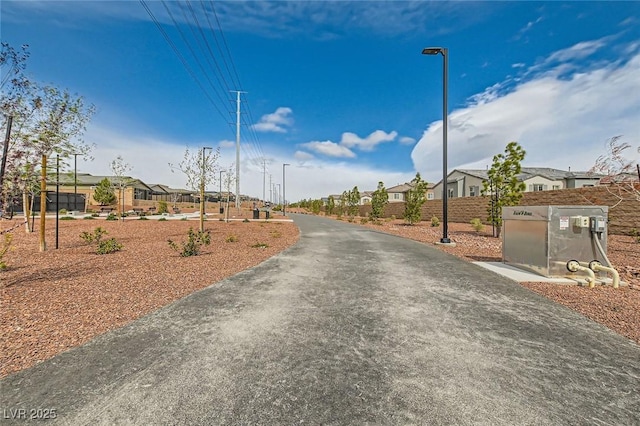 view of street featuring street lighting and a residential view