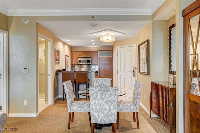 dining space with crown molding, recessed lighting, and baseboards