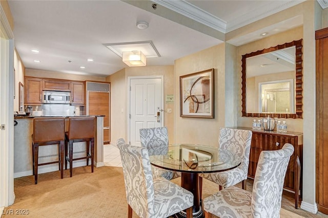 dining space with crown molding, recessed lighting, and baseboards