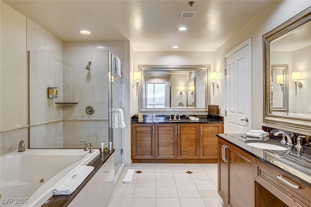 full bathroom featuring a sink, tiled shower, two vanities, and a tub with jets