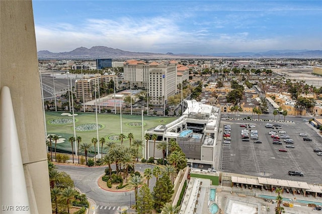 exterior space with a city view and a mountain view