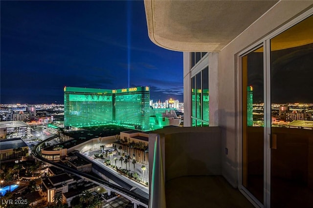 balcony at night with a view of city lights