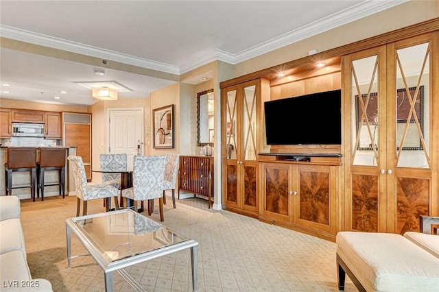 living area featuring crown molding and french doors