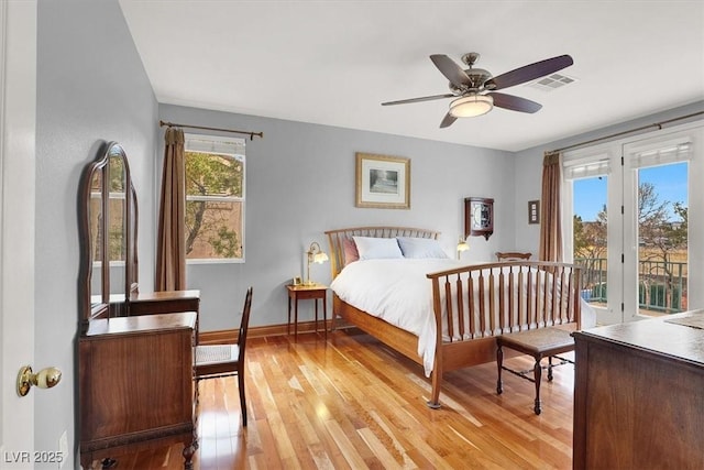 bedroom featuring light wood-style flooring, a ceiling fan, baseboards, visible vents, and access to exterior