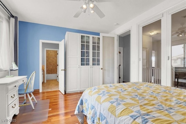 bedroom featuring light wood-type flooring and a ceiling fan