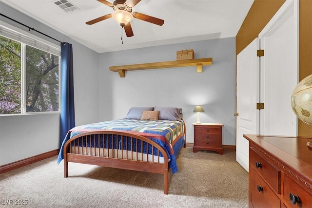 bedroom featuring light carpet, baseboards, visible vents, and a ceiling fan