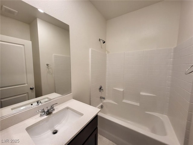 bathroom featuring vanity and washtub / shower combination