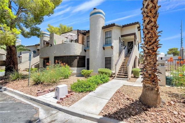 view of property featuring stairs