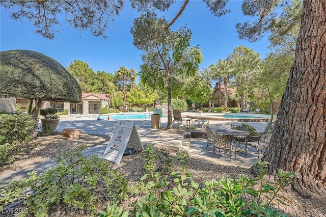 exterior space with a patio area and a community pool