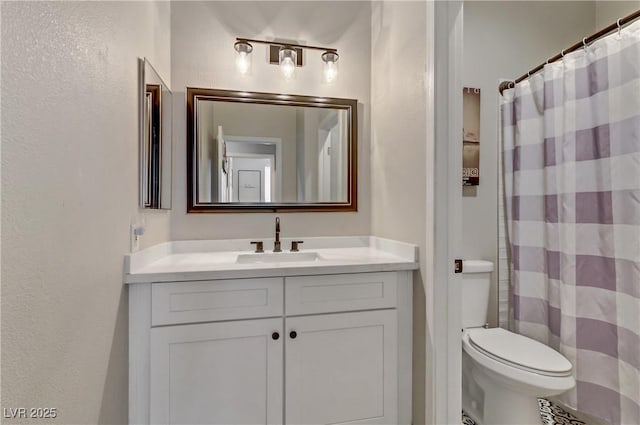 full bathroom featuring toilet, vanity, and a shower with curtain