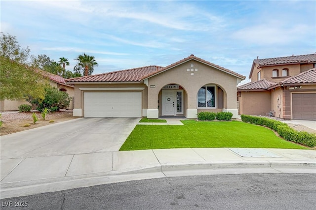 mediterranean / spanish house with an attached garage, driveway, a front lawn, and stucco siding