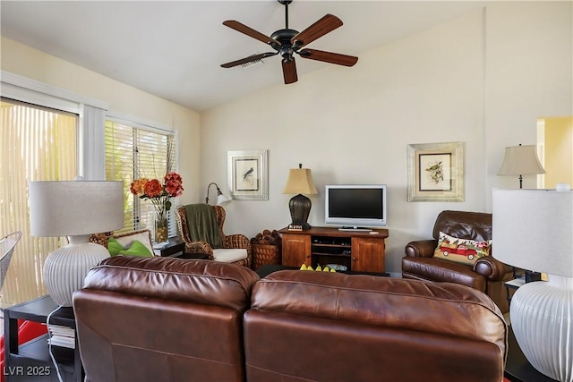 living area with visible vents, vaulted ceiling, and a ceiling fan