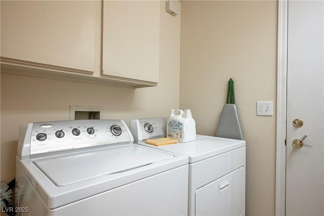 laundry room with washer and dryer and cabinet space