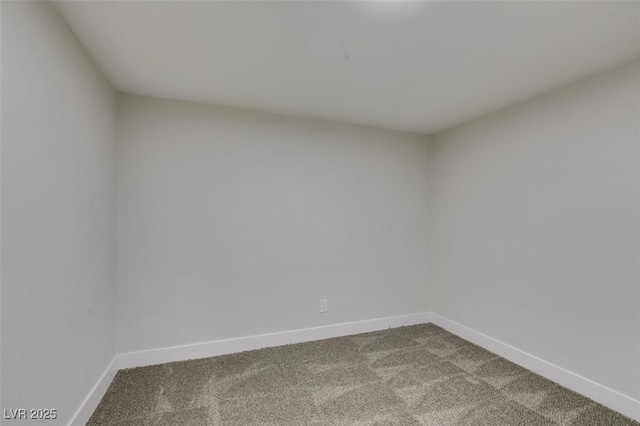 empty room with baseboards and carpet floors