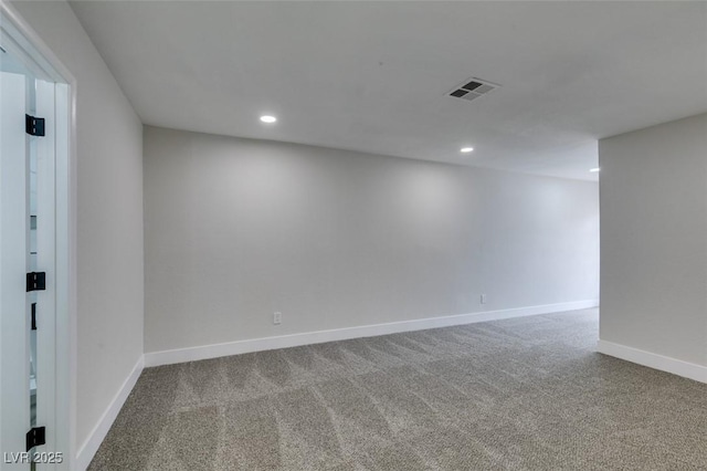 spare room featuring recessed lighting, visible vents, carpet flooring, and baseboards