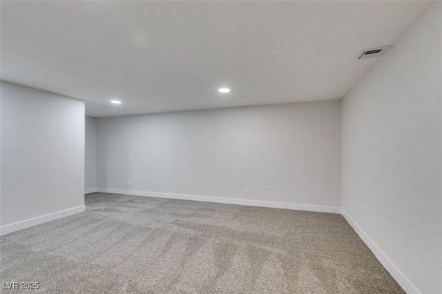 unfurnished room featuring visible vents, baseboards, and carpet floors