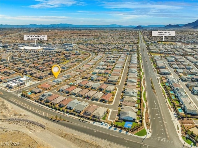 bird's eye view with a residential view and a mountain view