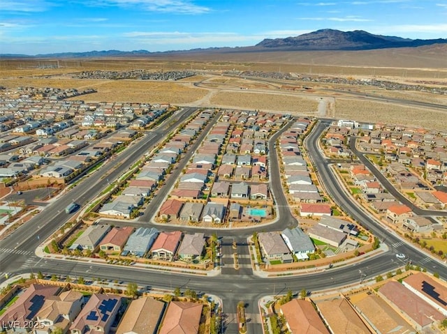 aerial view featuring a mountain view and a residential view