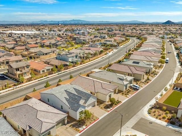 drone / aerial view featuring a residential view and a mountain view