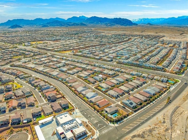 birds eye view of property with a residential view and a mountain view