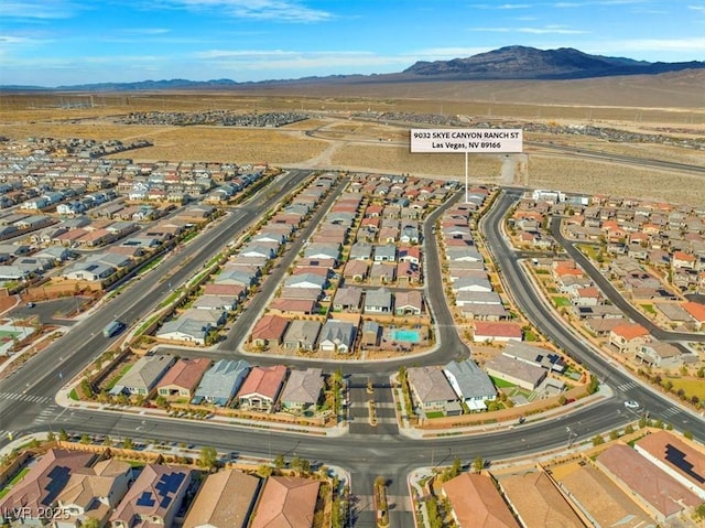 bird's eye view featuring a residential view and a mountain view