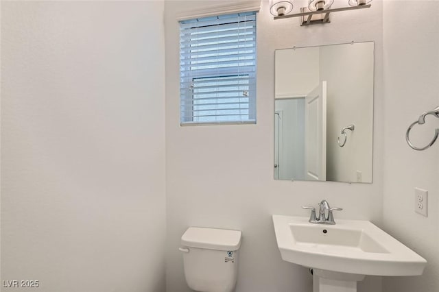 bathroom with a sink and toilet