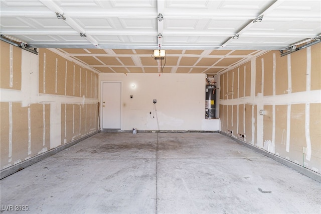 garage featuring water heater and a garage door opener