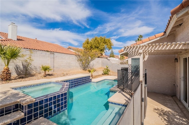 view of swimming pool with a fenced backyard, a pool with connected hot tub, and a pergola