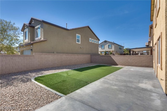 view of yard featuring a fenced backyard and a patio