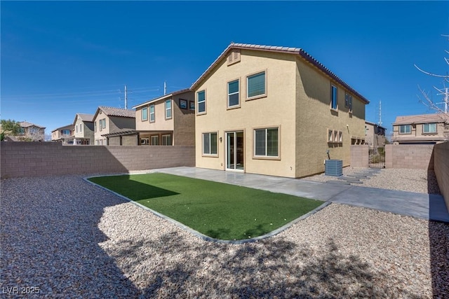 back of property featuring central air condition unit, a patio area, a fenced backyard, and stucco siding