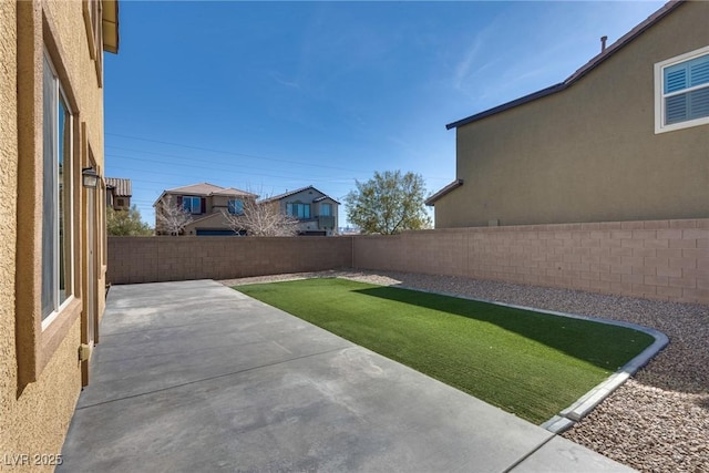 view of yard featuring a fenced backyard and a patio