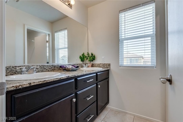 bathroom featuring a sink, a wealth of natural light, and tile patterned floors