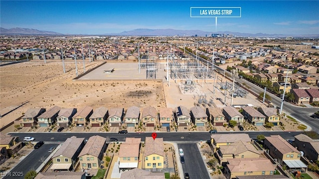 drone / aerial view with a residential view and a mountain view