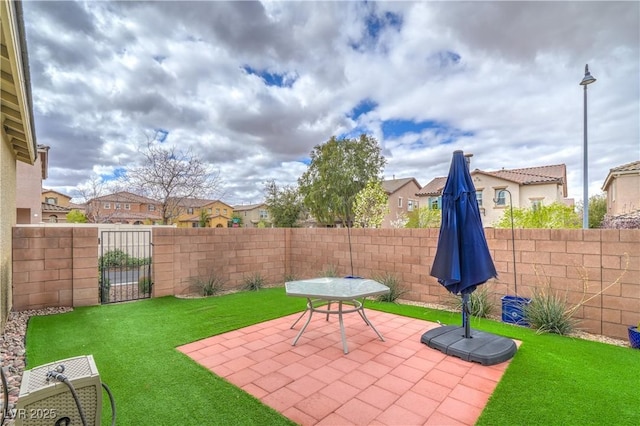 view of patio / terrace with a fenced backyard and a residential view