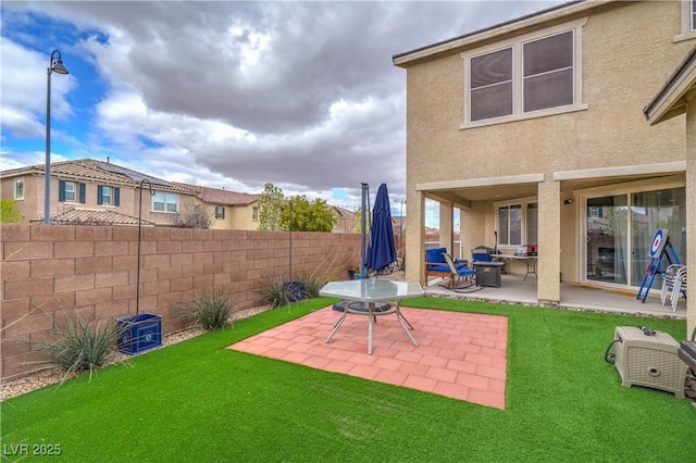 view of yard with a patio area and fence