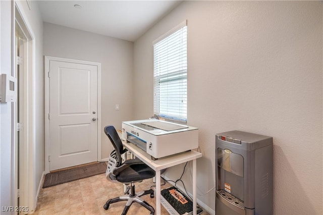 office space with tile patterned floors and baseboards